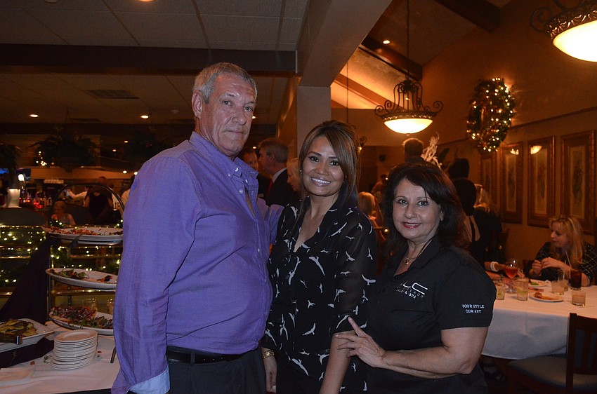 Ray Kindred, of Affiliated Enterprises, and Sidney Amerson and Moneer McKenney, of Les Ciseaux Salon and Spa