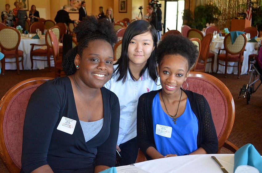 High school students Nahidia Promesse, Victoria Lam and Betty Jean came to learn about the local women who empower their community, they said.
