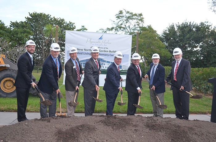 The Rev. Dr. Wes Bixby, James Hudgins, David Sessions, Philip Delaney, Harry Hobson, Dale Woodling, William Johnston and Duncan Finlay break ground.