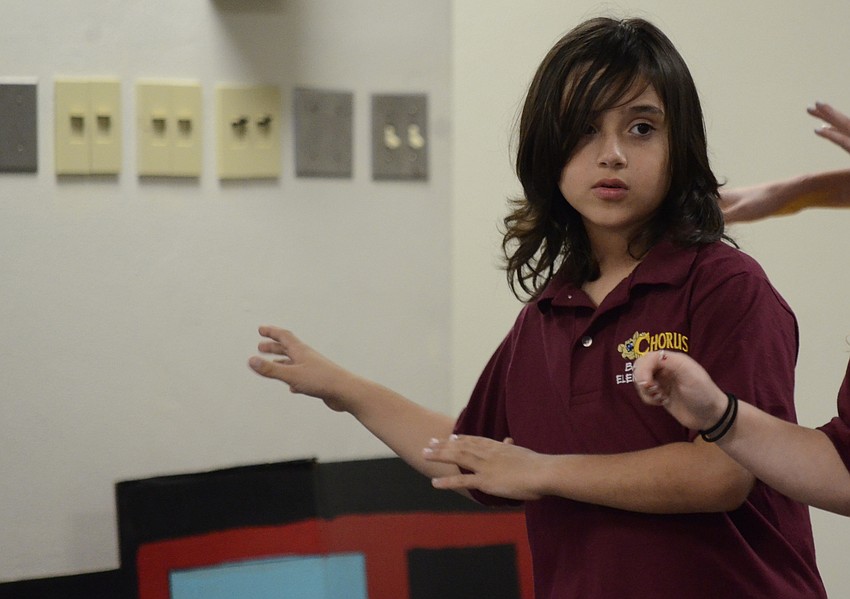 Trey Mena-Linderman does a luau dance during a song.