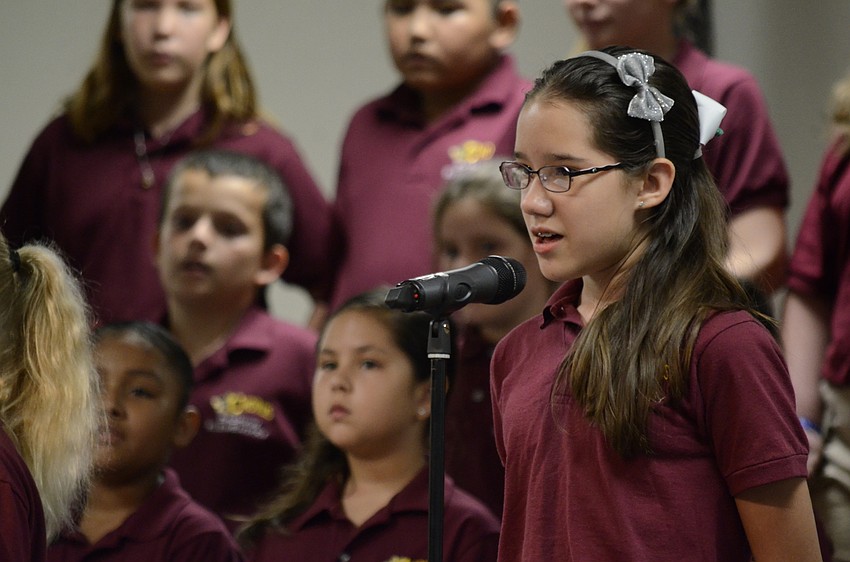 Kiara Obando sings soprano during a song.