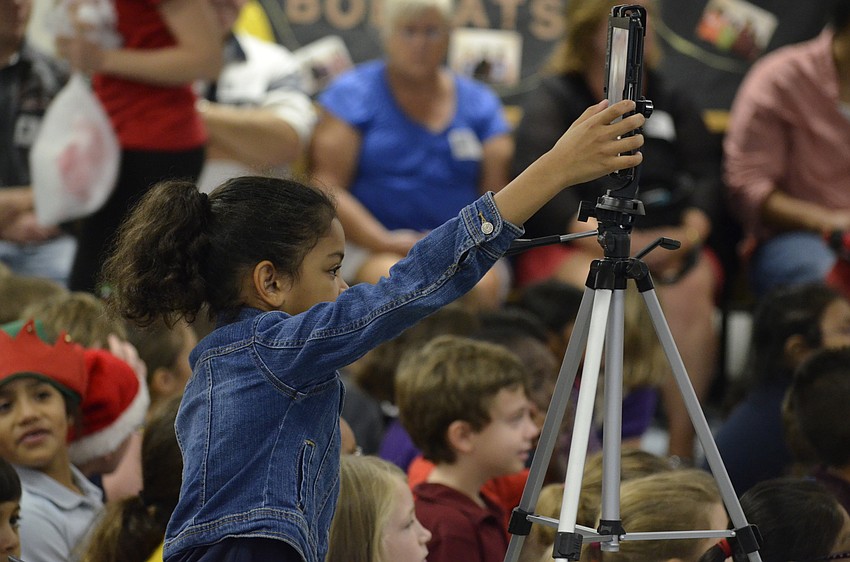 Dereon Lovette was in charge of recording the performance on an iPad.