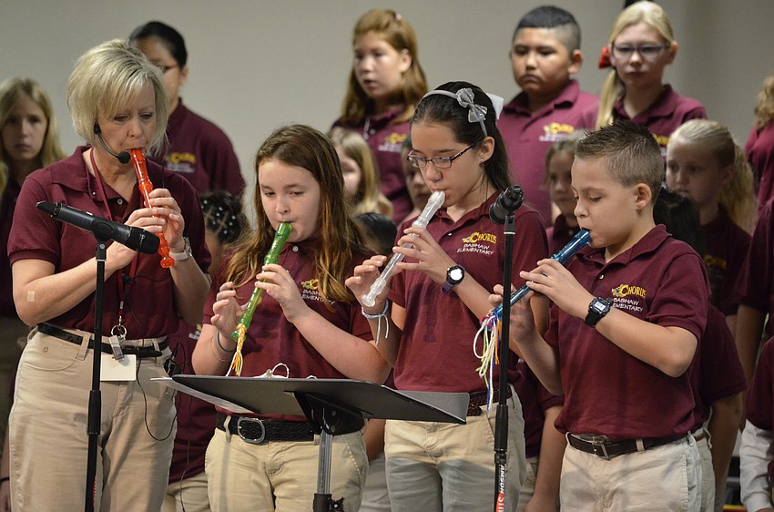 Barbara Sullivan, Sydney Brugger, Kiara Obando and Derek Jones play the recorder.