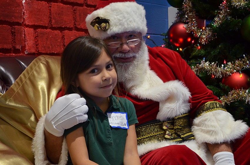 Andrea Jaramillo poses with Santa Claus.