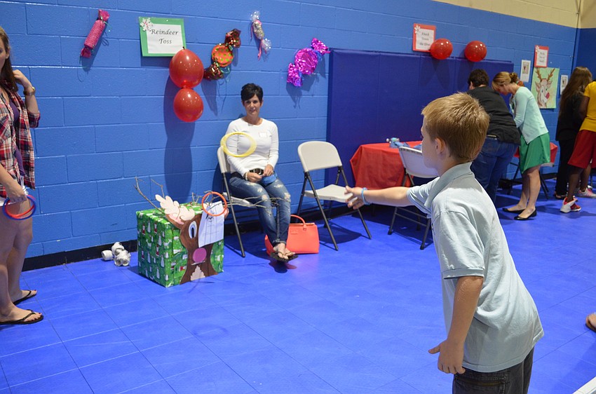 Dominic Wheeler plays the reindeer toss game.
