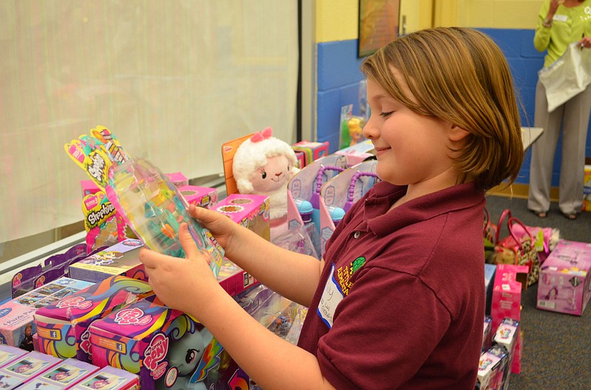 Emily Armstrong considers a Shopkin set as a gift.