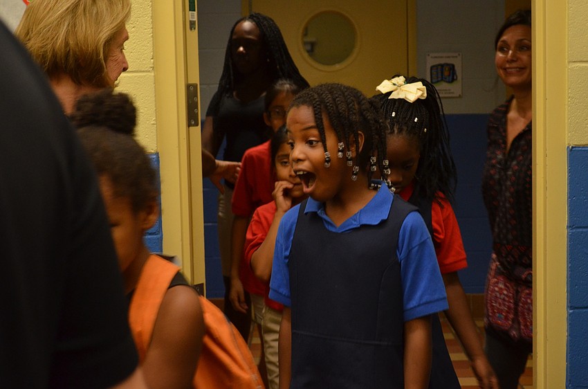 Mykayla Graham's first glance at the present room where children were able to take their pick of three gifts to bring home.