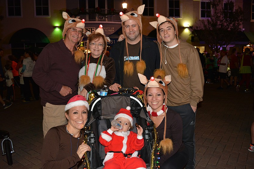 Santa, Adam Schwab, led his team of reindeer (clockwise from left) Amy Tanaka, John Beehler, Maureen McCracken, Paul Schwab, Michael Beehler and Lisa Tanalca.