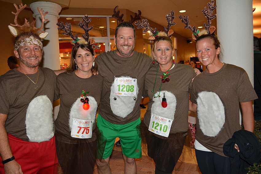 Bill O'Shea, Josie Reside, Chris Ash, Debbee Creamer, Mallory Carteaux and Kate Irby, not pictured, came as Santa's reindeer.