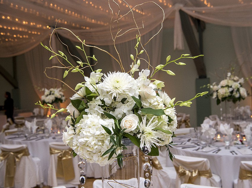 Catering and tables by Michael's On East, floral decor by Flowers By Fudgie