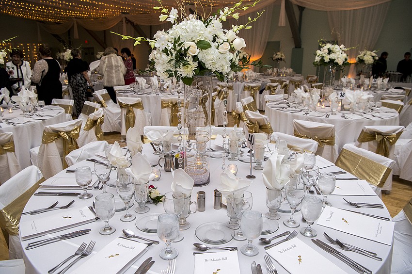 Catering and tables by Michael's On East, floral decor by Flowers By Fudgie