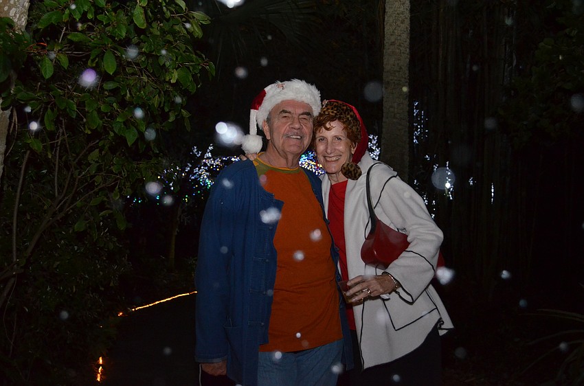 Greg and Lorrie Wilkins get a snowy surprise along the path at Marie Selby Botanical Gardens.