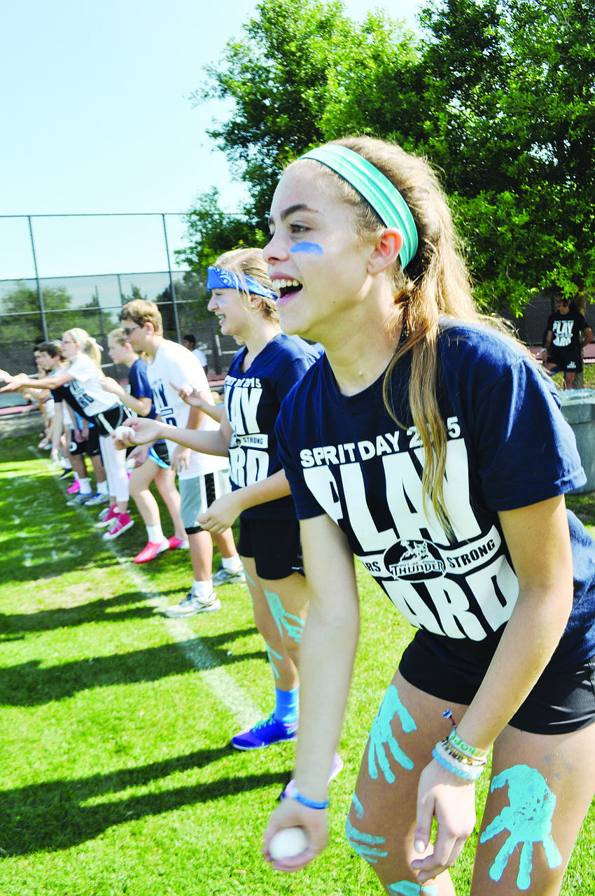 Madisyn Opstal, 13, attempts to gently toss an egg to her partner during The Out-of-Door Academy’s Spirit Day.