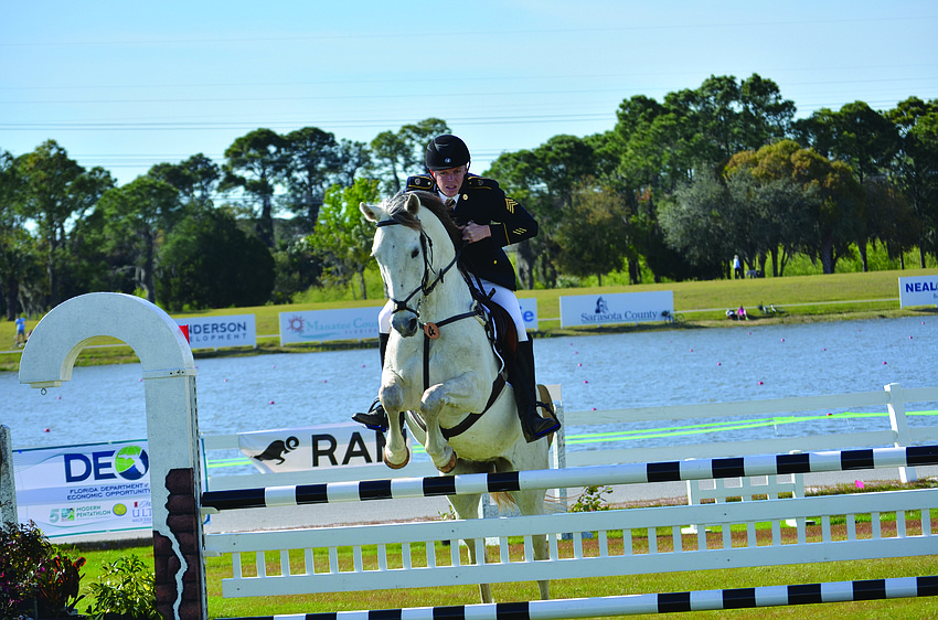 Left: Dennis Bowsher sails over a jump with his horse while competing in the Modern Pentathlon World Cup No. 1.