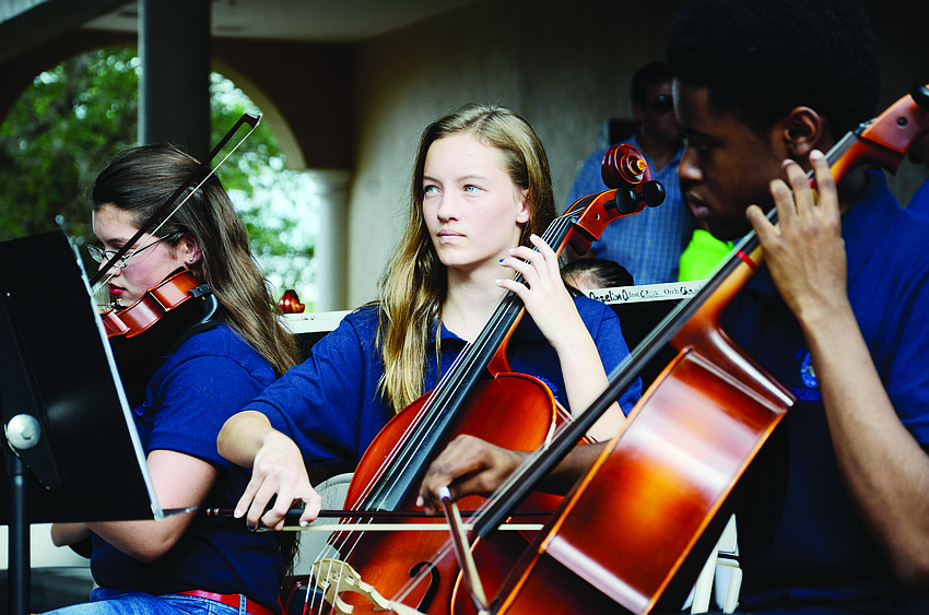 Basia Kuehn plays in the Nolan Middle School’s chamber orchestra during Nolan Night on Main Street.