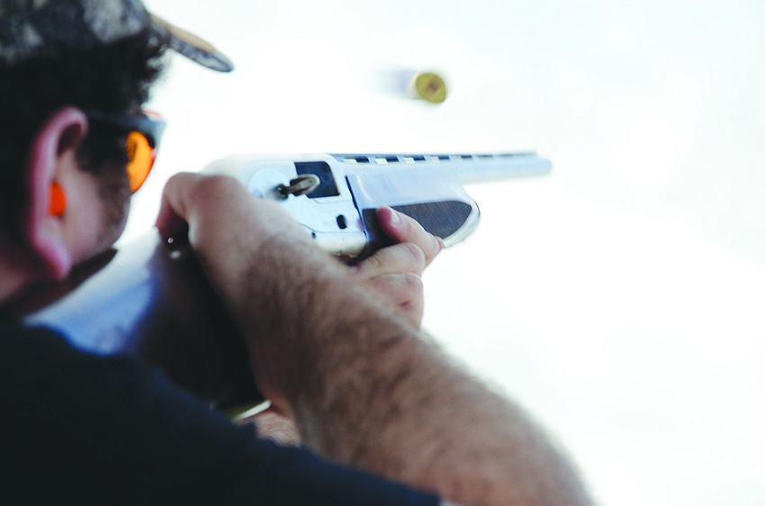 Jordan Blanton’s shotgun shell flies after he shoots a clay during the Harvest Moon Classic.