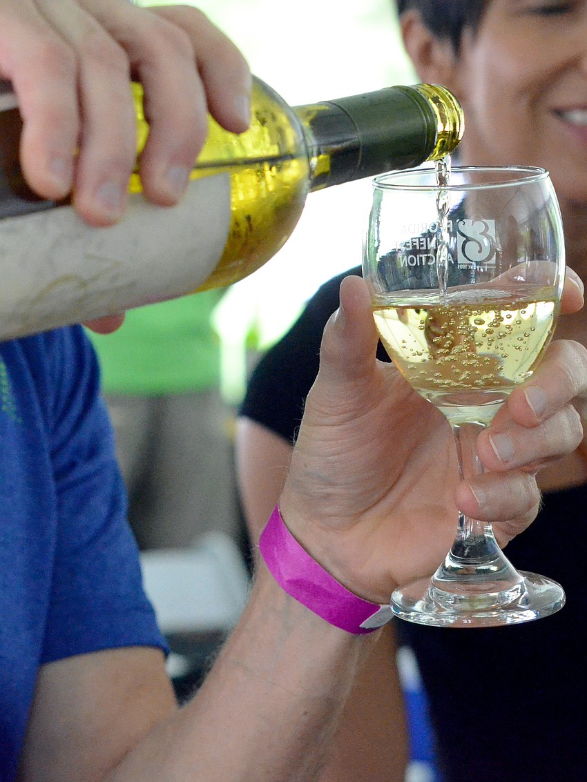 A guest samples a John Anthony sauvignon blanc.