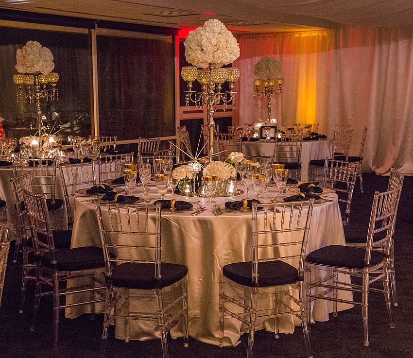 Catering and table decor: Michael's On East
Organization & Design: Roger Capote.
Florals by Flowers by Fudgie. 
Draping and lighting: Affairs in the Air, Inc.