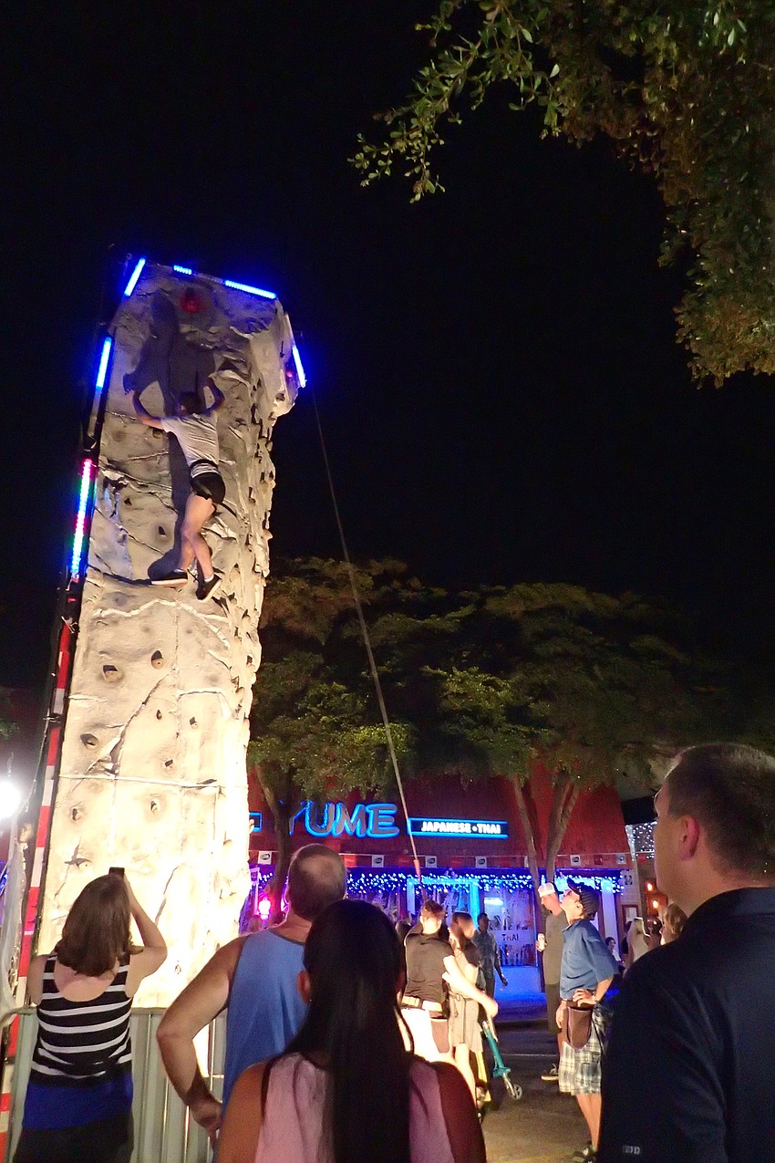 Jackson Kernion comes a hair's breadth from winning the grand prize on the climbing wall.