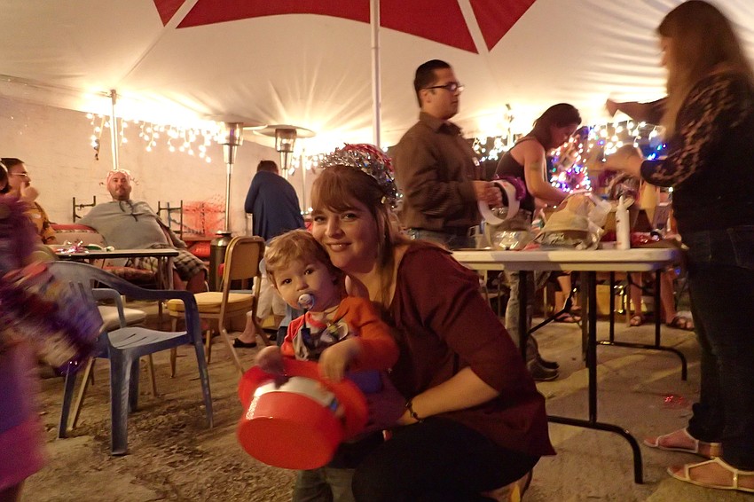 (right to left): Jennifer and Joey Strauss enjoy the potluck celebration