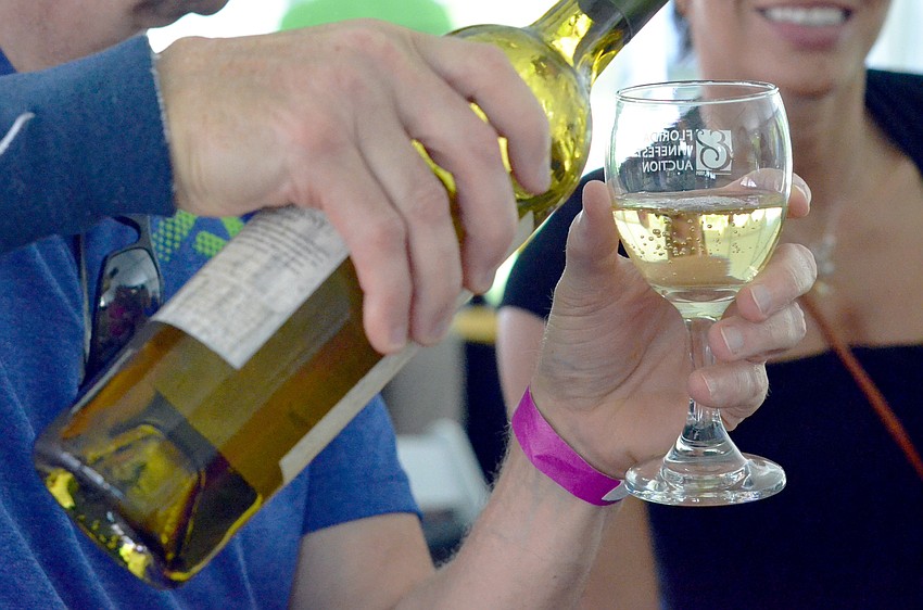 A guest samples a John Anthony sauvignon blanc.