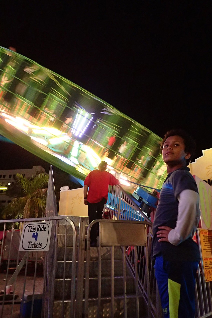 Mikael Tafesse looks over his shoulder as the wheel spins.