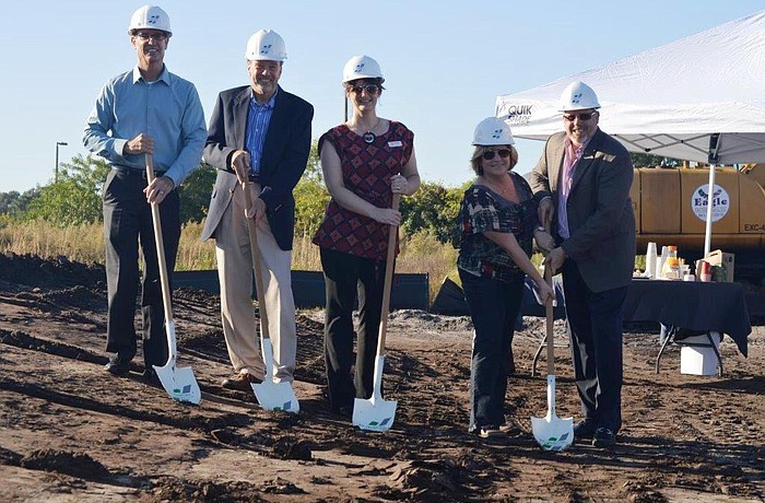 Jeff Burkee, senior vice president Bank of Commerce, Bob Simon, president of development for SMR, Laura Adcock, WBRC Architects, and Crawford Construction owners Utahna Smith and Jeff Smith break ground.