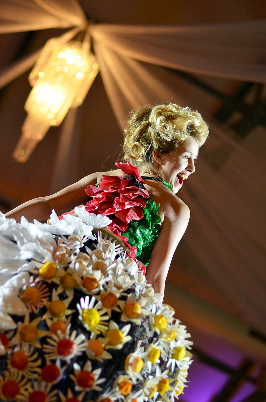 Chessi Phillips models iConcept artist Lisa Berger’s ‘Good to the Last Drop (of her head)’ at Art Center Sarasota’s iConcept7 Jan. 22.