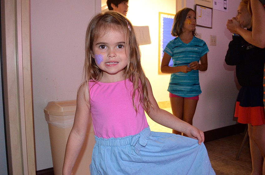 Bailey Folk models her dress after twirling on the dance floor.