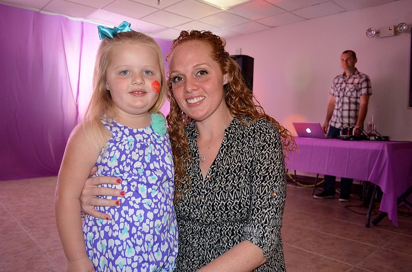 Addisson Gebhart and her mother, Rebecca, enjoy family time on the dance floor.