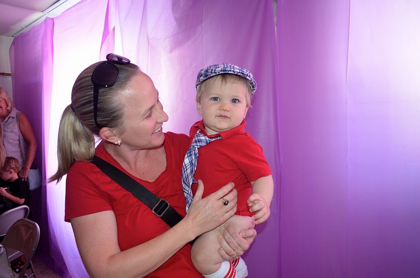 Danielle Hartley and her son, Weston, dance to the music.