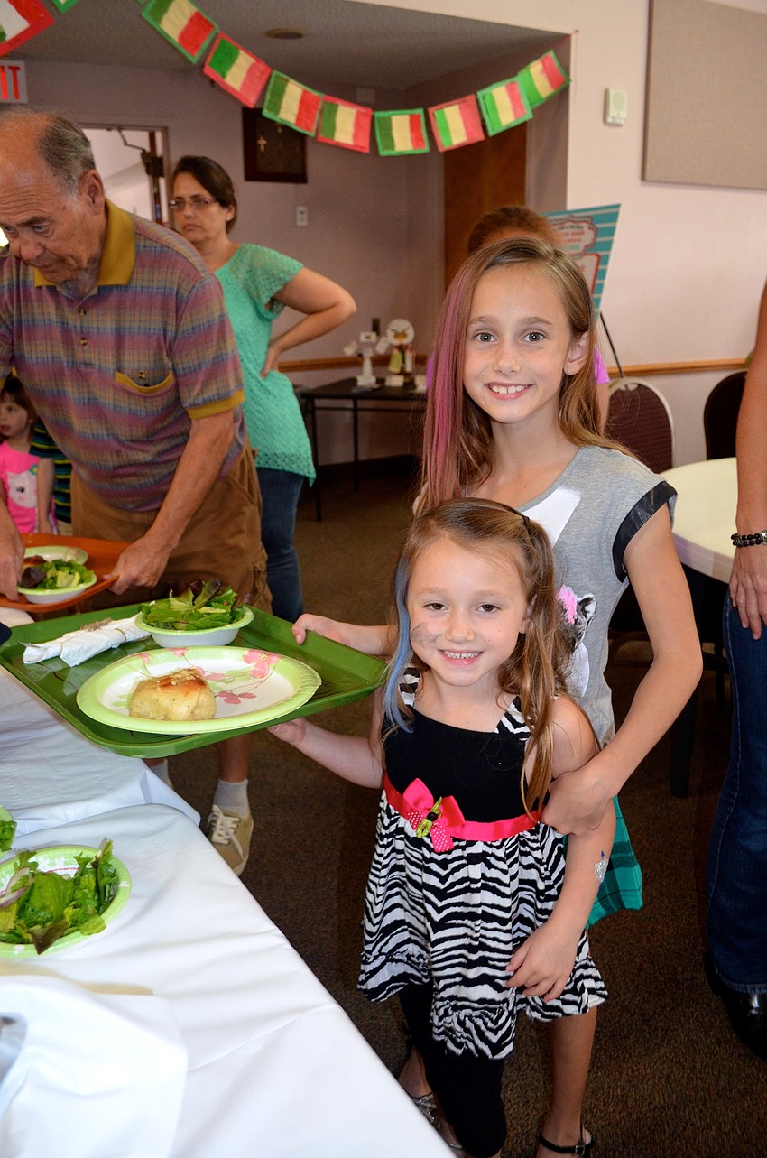 Sisters Corin and Camilla Mohammadhoy pick out their dinner items.