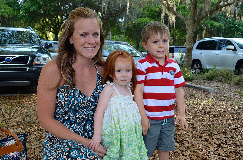 Rachel Wiedeman and her children, Selah and Grady, look forward to dinner and games at their church.