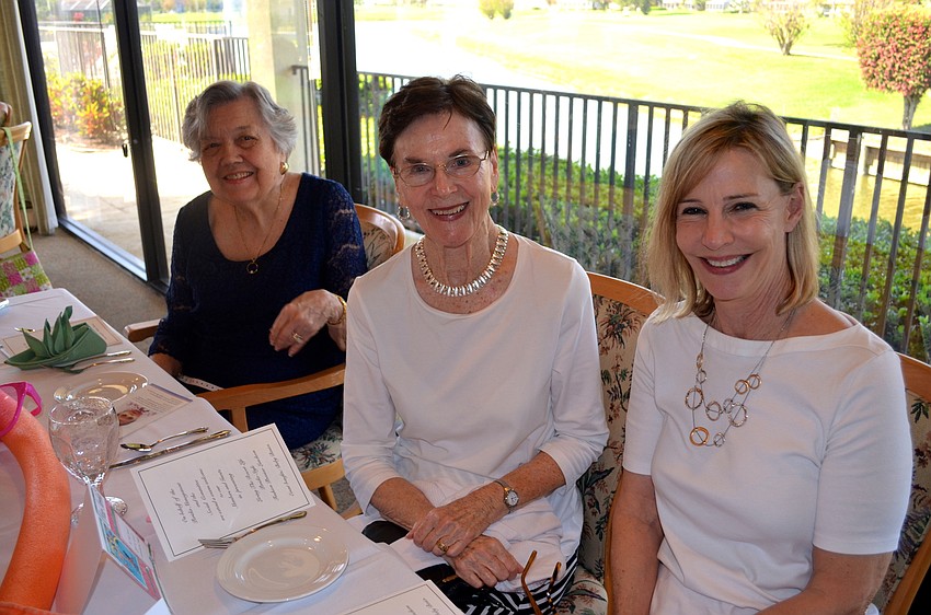 Marge Bagge, Clare Sutter and Charlene Crable look forward to the fashion show.