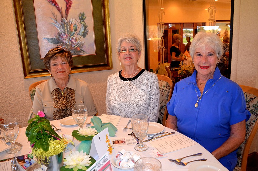 Barb Hungate, Sharon Fawcett and Charlene Crable enjoy cold drinks and chat time before the event.