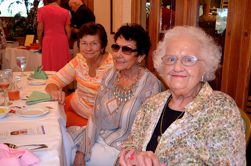 B.J. Sherrell says cheese, flanked by two friends, Shelah Stage and Inez Veraldi.