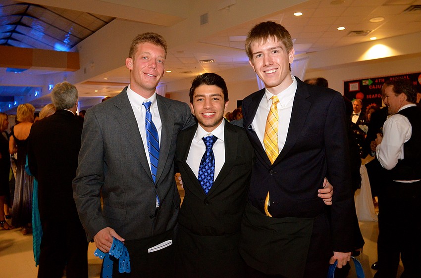 James Davenport distributed raffle tickets with guest speakers Justin Najmy and John Dowling.