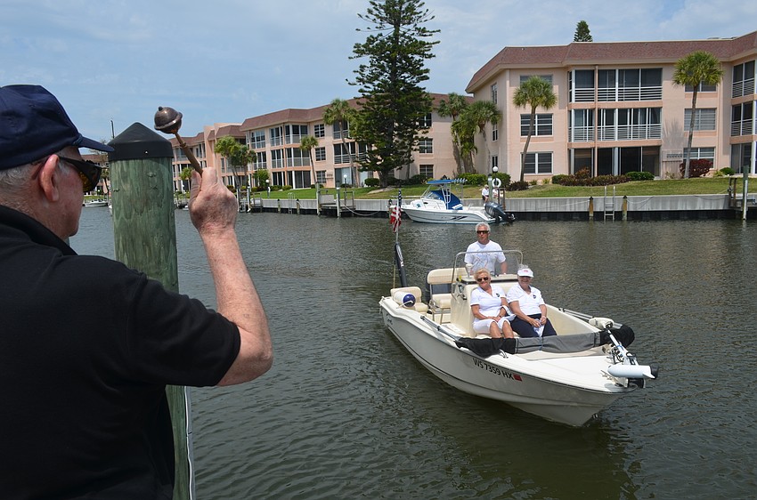 Msgr. Gerry Finegan blesses Tom Vitro’s boat.