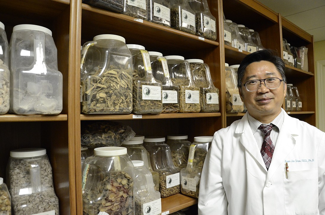 Ruan Jin Zhao, a doctor of Oriental medicine, prefers to use herbal concoctions to treat his patients. Some herbal remedies come pre-mixed, and others he has to make himself.