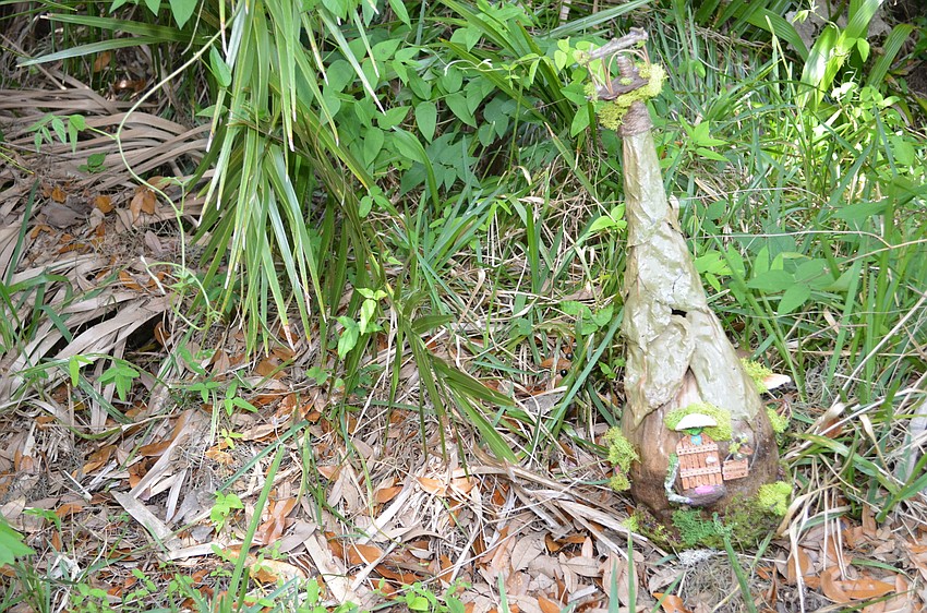 An entry called Coconut Cottage blends in with the greenery.