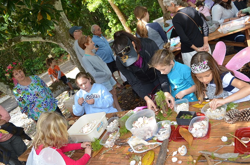 A table for children to build their own versions of a fairy house included shells, clay, tree branches and leaves.
