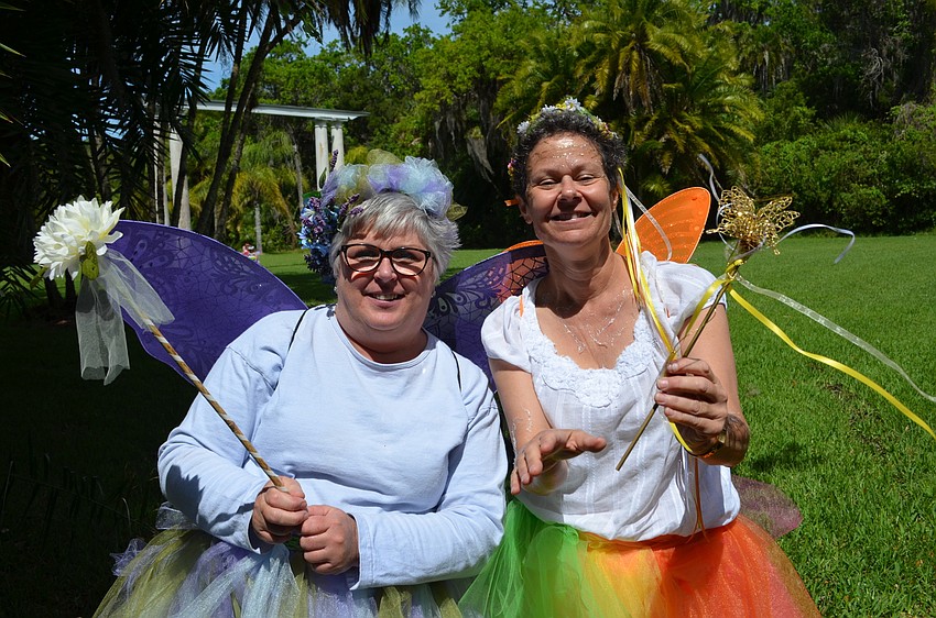 Fairy of the Hydrangeas and Fairy of the Daisies Jane Glennan and Marilyn Schwartz take a break from spreading fairy dust for a photo.