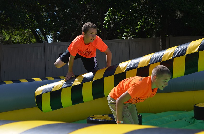 Aidan Strzempka leaps over the obstacle course.