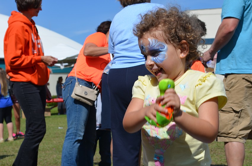 Allie McLaughlin is excited that she caught a sea turtle stuffed animal.