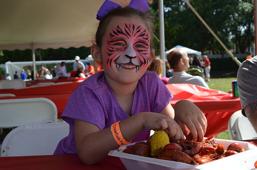 Fiona Pitts digs into her crawfish dinner.