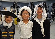 Laura Florez-Rey, Justein Savwoir and Sean Bruinius each dressed as George Washington for Morning at the Museum.