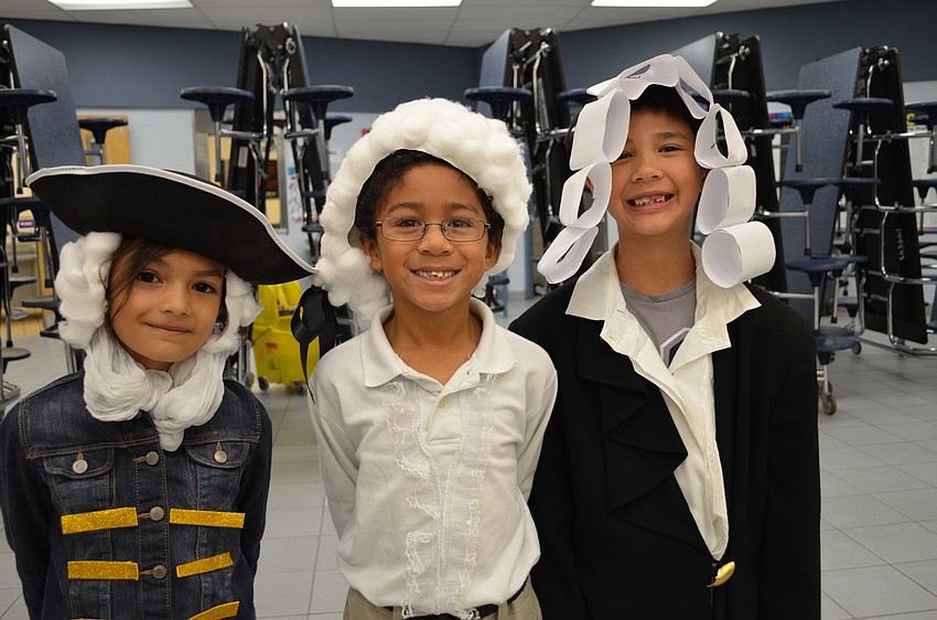 Laura Florez-Rey, Justein Savwoir and Sean Bruinius each dressed as George Washington for Morning at the Museum.