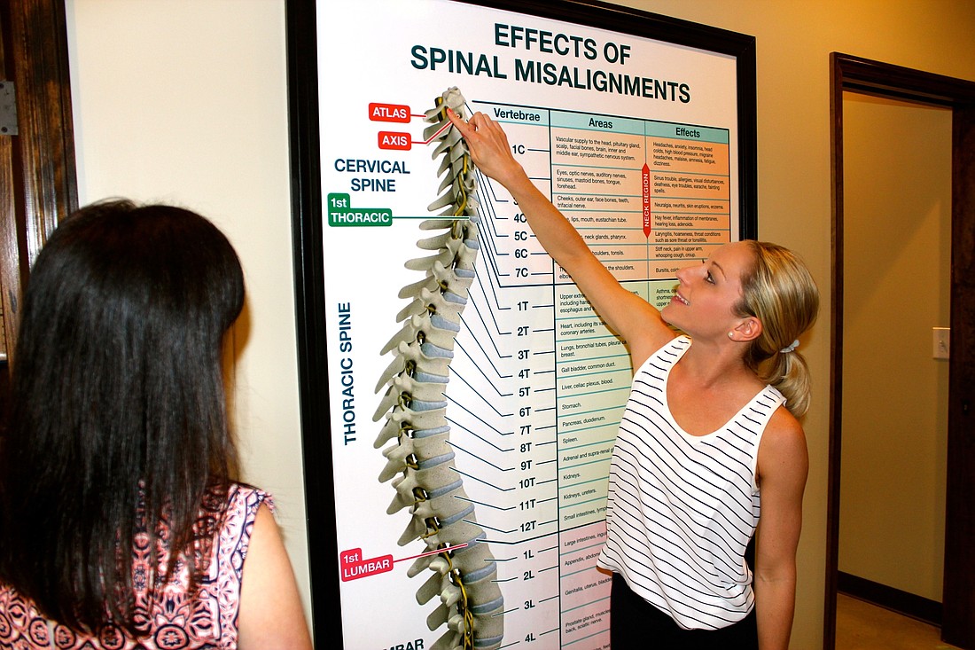 Chiropractors Laura and Logan Swaim educate their patients on the effects of misalignments and other back issues.