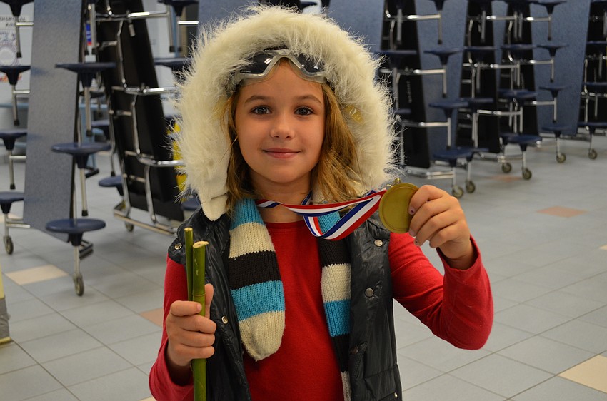 Greene embodied Olympic skier Lindsey Vonn complete with cardboard skis, bamboo branches as ski poles and a medal.