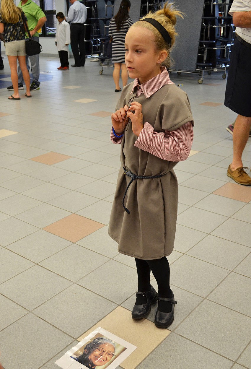 Carly Redman recites the facts she researched for Rosa Parks.